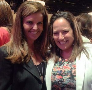Wendy Santana, a former nonprofit executive, with Maria Shriver at a charitable event