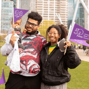 Young couple with child at Chicago BT5K in Maggie Daley Park on April 30, 2023